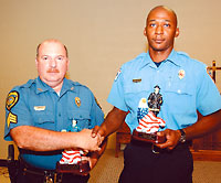Police Sgt. Ken Edwards and firefighter Jourdon Pope