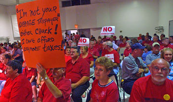 Protest signs at annexation hearing