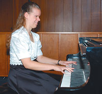 C.J. Watson playing piano